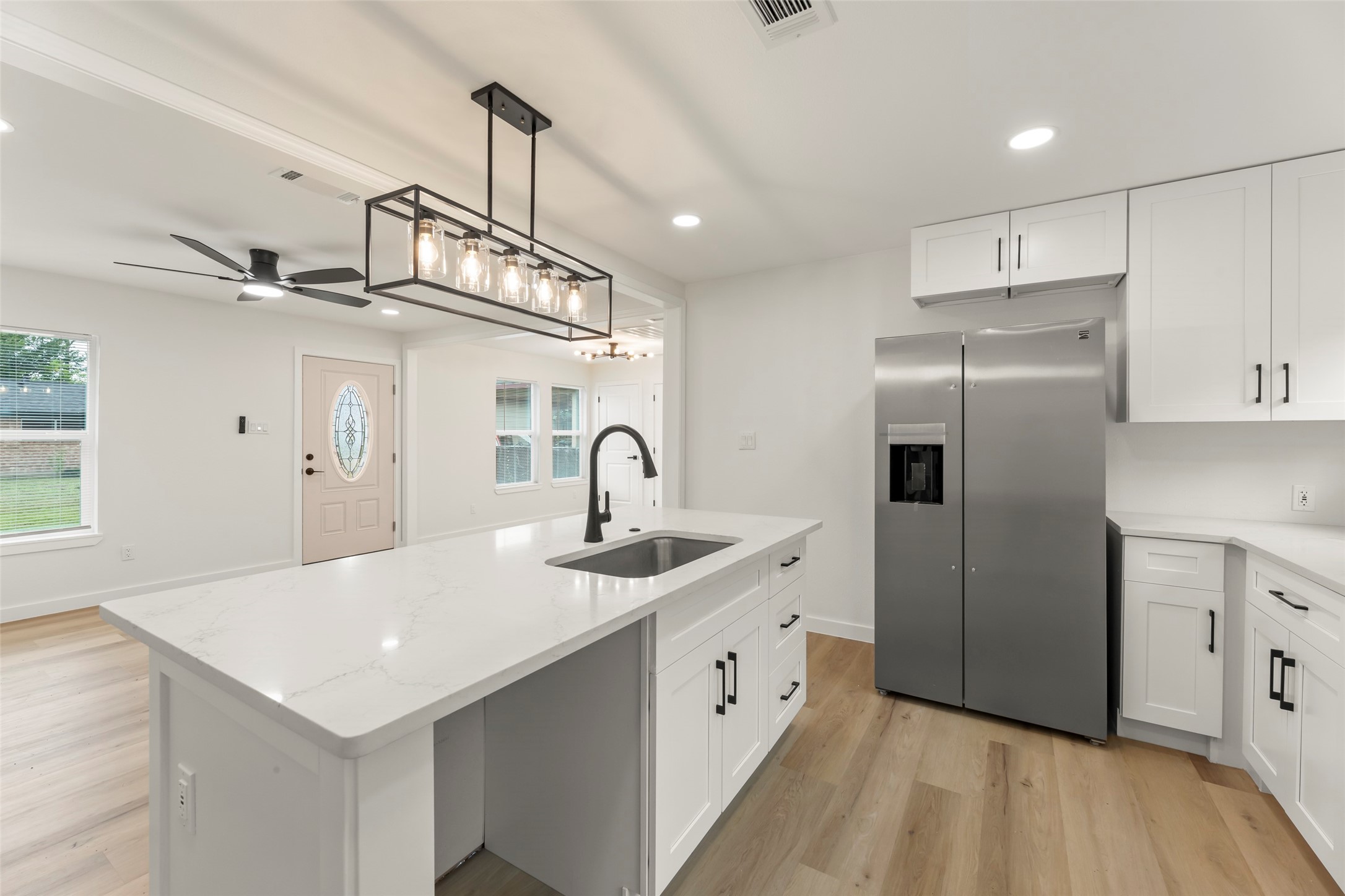 3225 Bostic Street Houston, TX 77093 - Photo 32 of 50 A gorgeous kitchen featuring a sleek quartz breakfast bar.