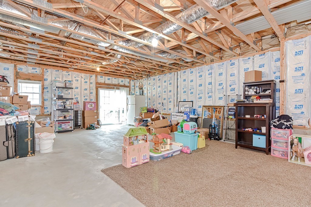 522 Detroit Street Fall River, MA 02721 - Photo 24 of 32 a view of a garage with storage