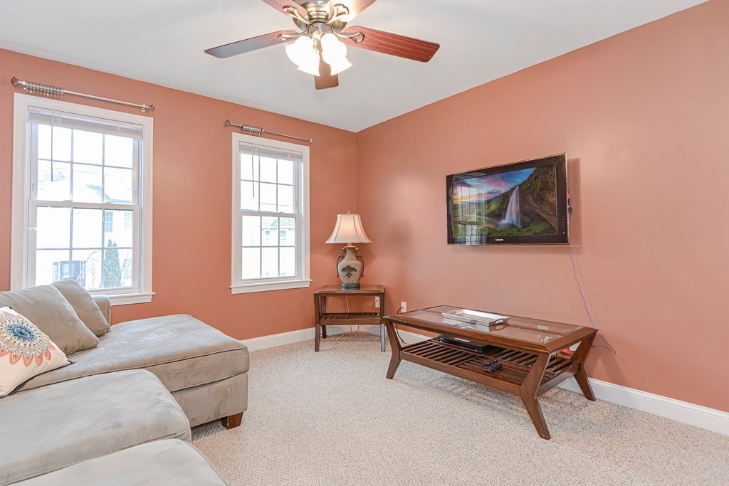 522 Detroit Street Fall River, MA 02721 - Photo 10 of 32 a living room with furniture and a window