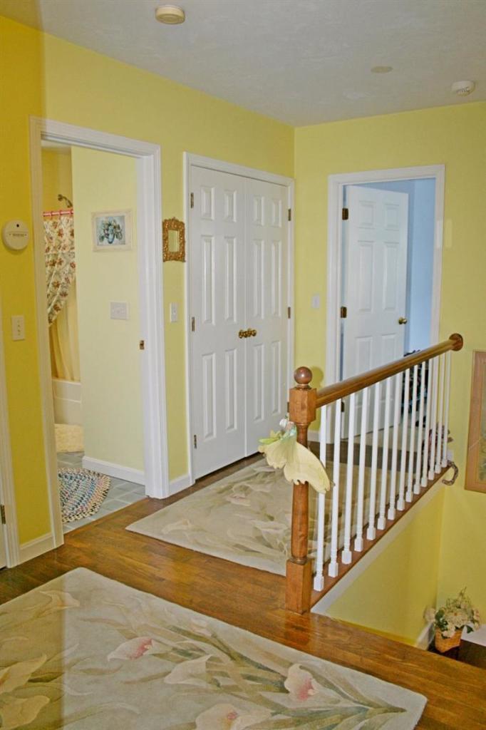 275 Quasons Path Brewster, MA 02631 - Photo 18 of 32 a view of a hallway with wooden floor and front door