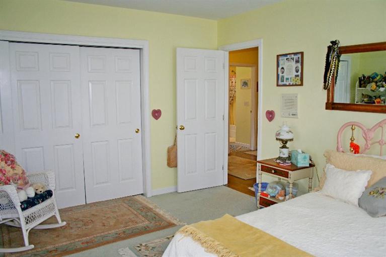 275 Quasons Path Brewster, MA 02631 - Photo 27 of 32 a bedroom with a bed and furniture
