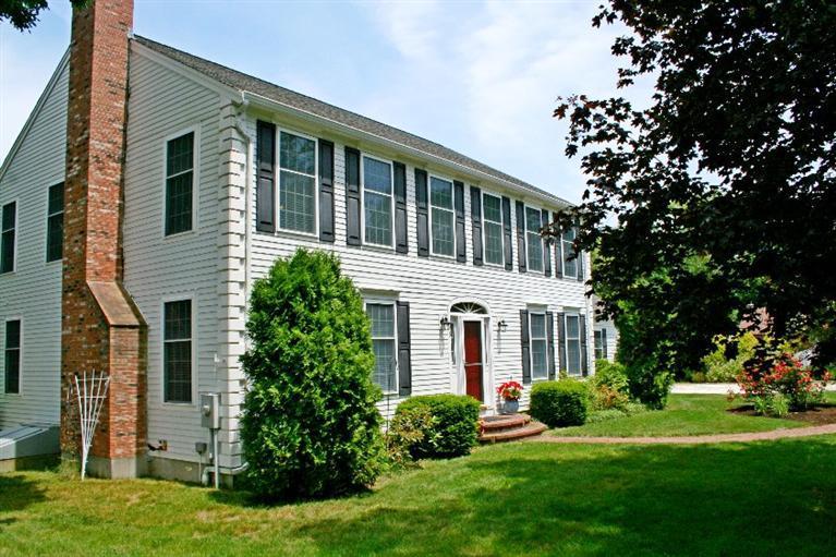 275 Quasons Path Brewster, MA 02631 - Photo 31 of 32 a front view of a house with a yard and trees