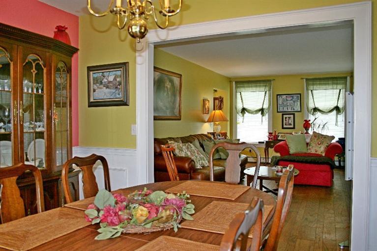 275 Quasons Path Brewster, MA 02631 - Photo 7 of 32 a bedroom with furniture and a chandelier