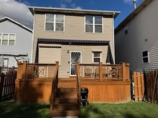 a balcony with wooden floor and white walls