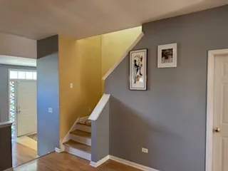 a view of staircase with wooden floor and stairs