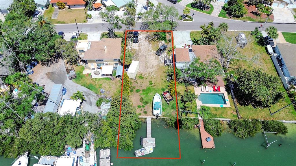 317 12th Avenue Indian Rocks Beach, FL 33785 - Photo 13 of 31 an aerial view of a house with a yard and lake view