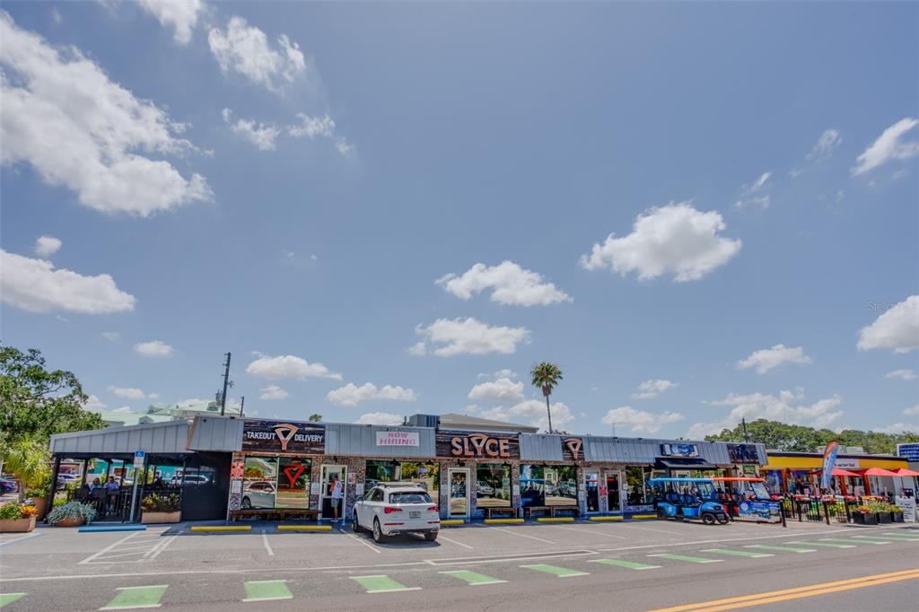317 12th Avenue Indian Rocks Beach, FL 33785 - Photo 29 of 31 a group of cars parked in front of building