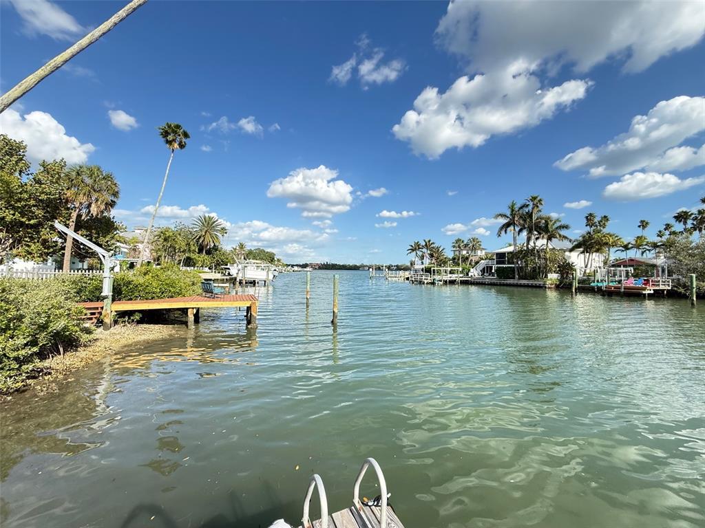317 12th Avenue Indian Rocks Beach, FL 33785 - Photo 31 of 31 a view of a lake with lawn chairs