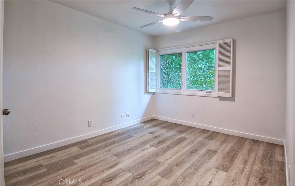 6061 Sierra Bravo Road Irvine, CA 92603 - Photo 16 of 22 a view of empty room with wooden floor and fan