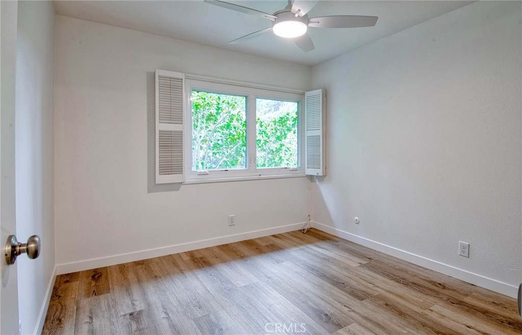 6061 Sierra Bravo Road Irvine, CA 92603 - Photo 17 of 22 wooden floor in an empty room with a window