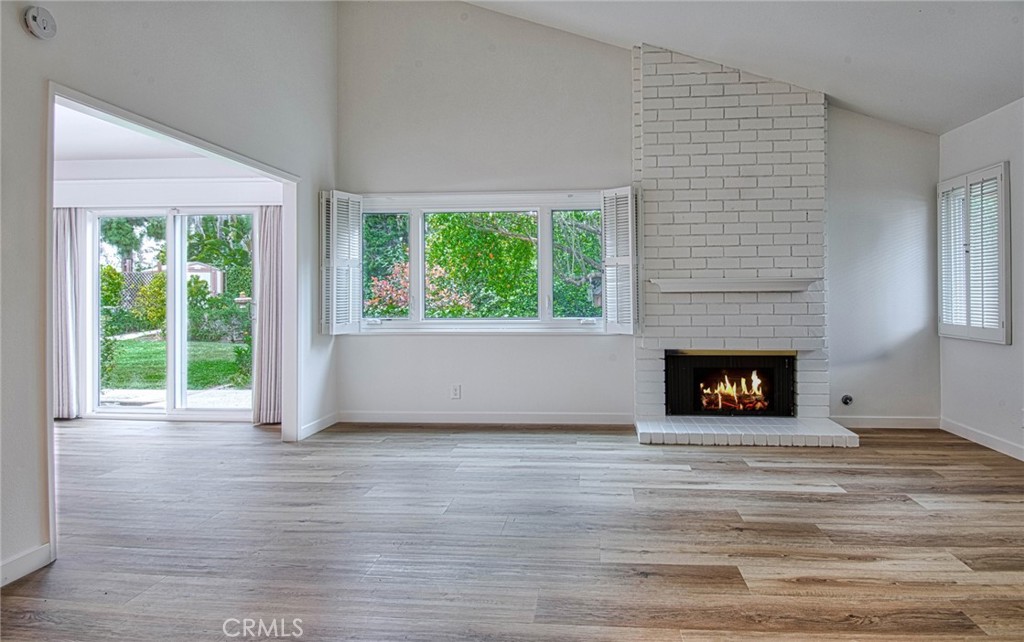6061 Sierra Bravo Road Irvine, CA 92603 - Photo 5 of 22 a view of an empty room with a window and fire place
