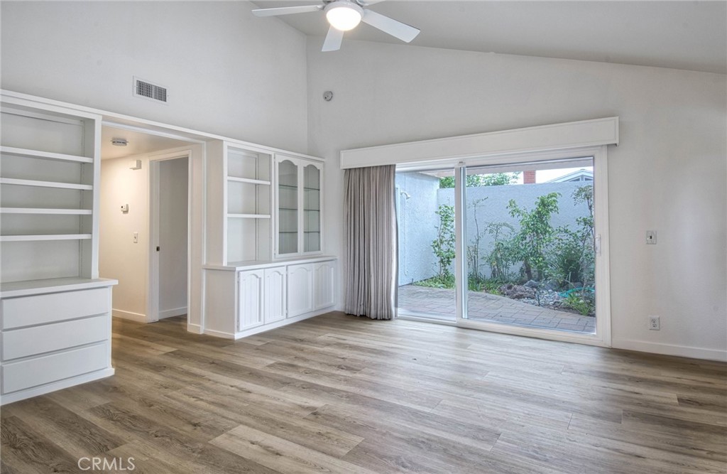 6061 Sierra Bravo Road Irvine, CA 92603 - Photo 9 of 22 a view of an empty room with wooden floor and a window
