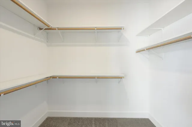 a view of an empty walk in closet
