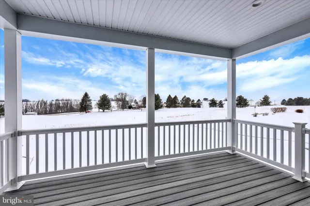 a view of a porch with wooden floor