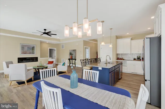 a large kitchen with a table and chairs