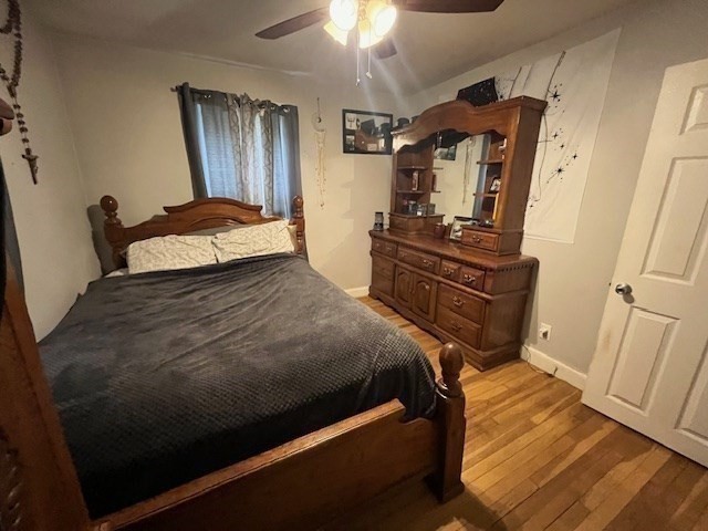 4 Summit Street Waltham, MA 02451 - Photo 14 of 22 a bedroom with a bed and a mirror on the dresser