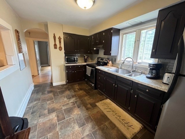 4 Summit Street Waltham, MA 02451 - Photo 5 of 22 a large kitchen with a sink stainless steel appliances and cabinets