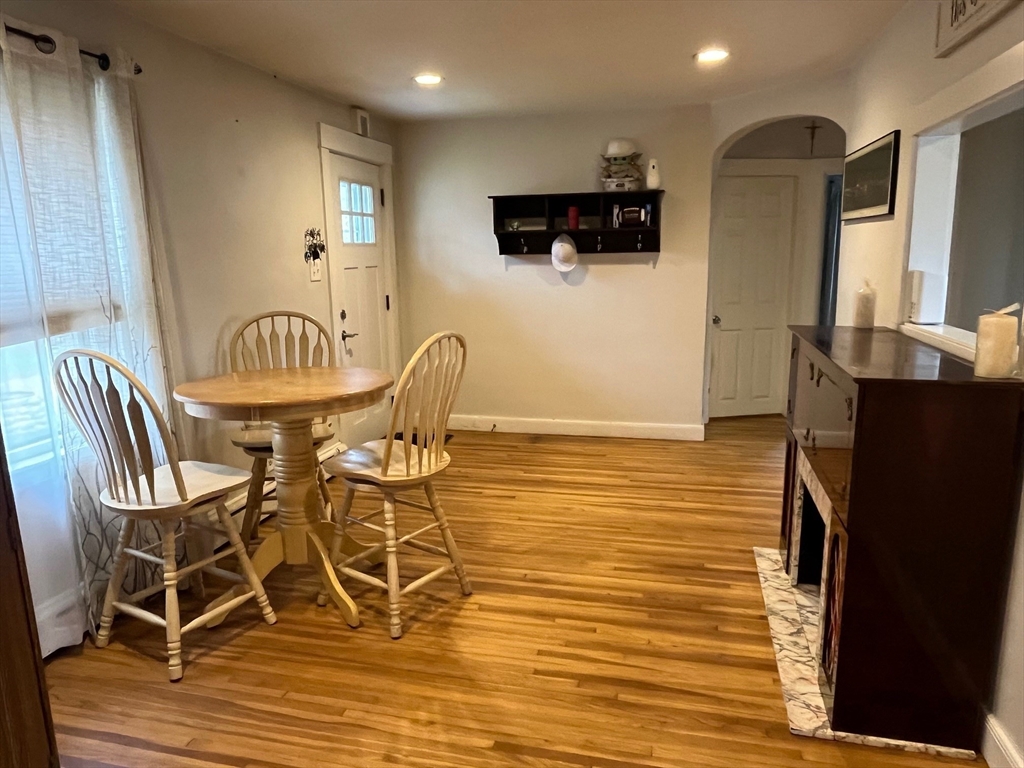 4 Summit Street Waltham, MA 02451 - Photo 8 of 22 a view of a dining room with furniture and wooden floor