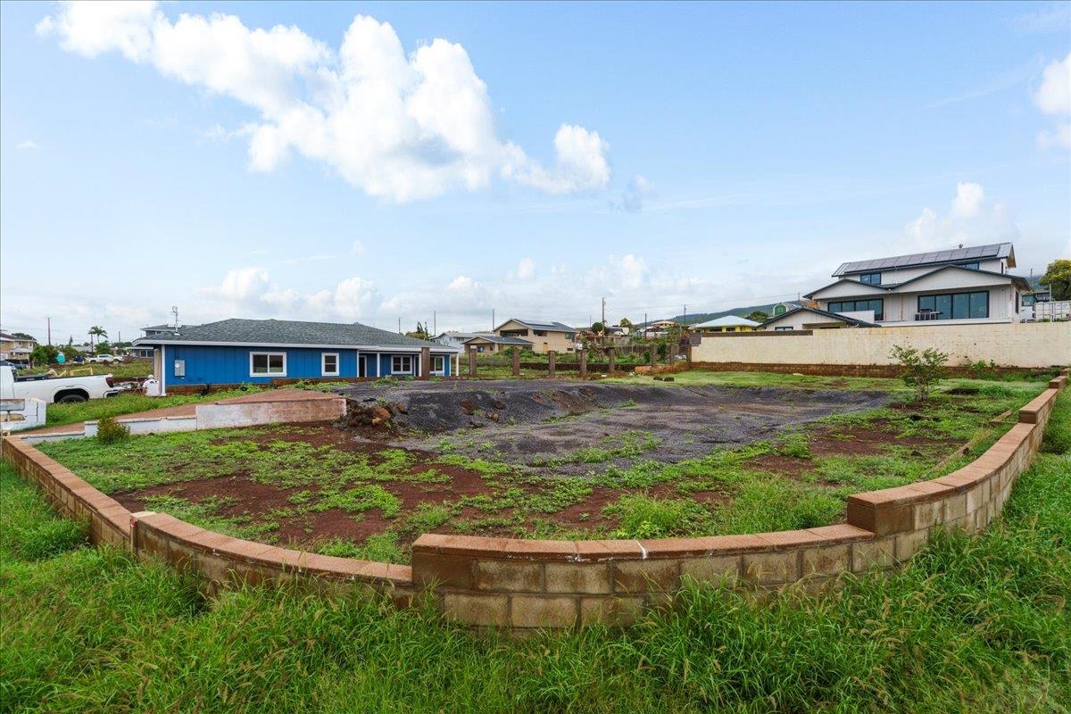 1560 Ainakea Road Lahaina, HI 96761 - Photo 5 of 25 a view of a swimming pool with lawn chairs and large trees