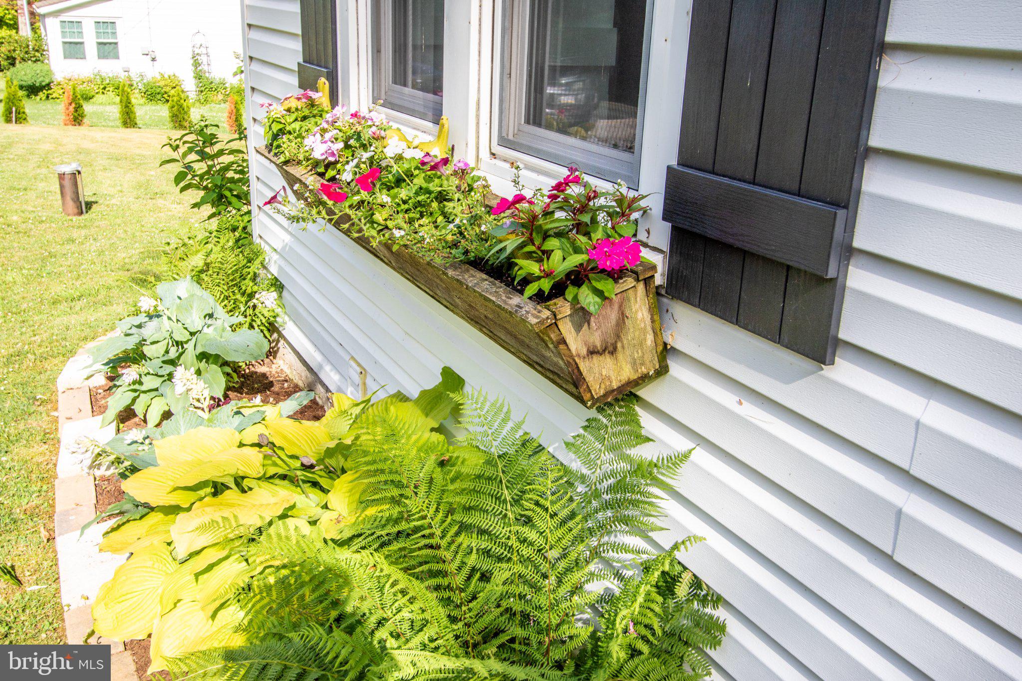 2056 Ridge Road Elverson, PA 19520 - Photo 66 of 89 Charming blooms brighten the facade.