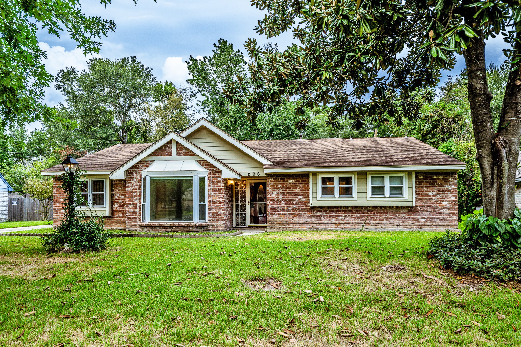 206 Hickory Ridge Drive Shenandoah, TX 77381 - Photo 1 of 35 a front view of a house with yard and green space