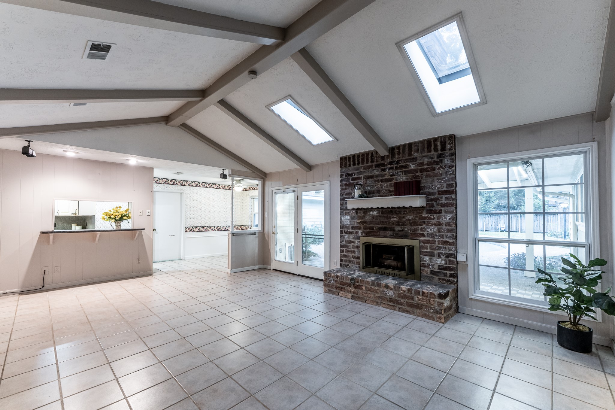 206 Hickory Ridge Drive Shenandoah, TX 77381 - Photo 17 of 35 a view of a kitchen with furniture and a fireplace