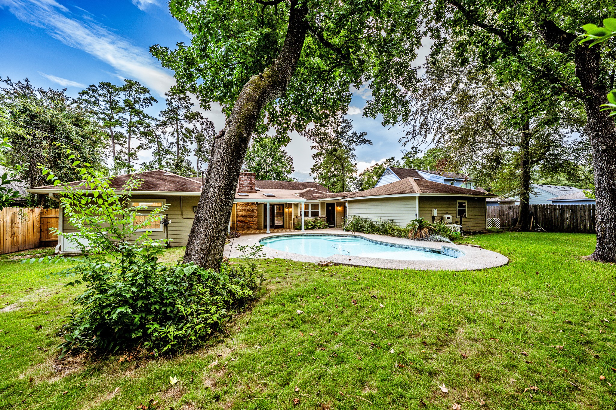206 Hickory Ridge Drive Shenandoah, TX 77381 - Photo 2 of 35 a front view of a house with garden