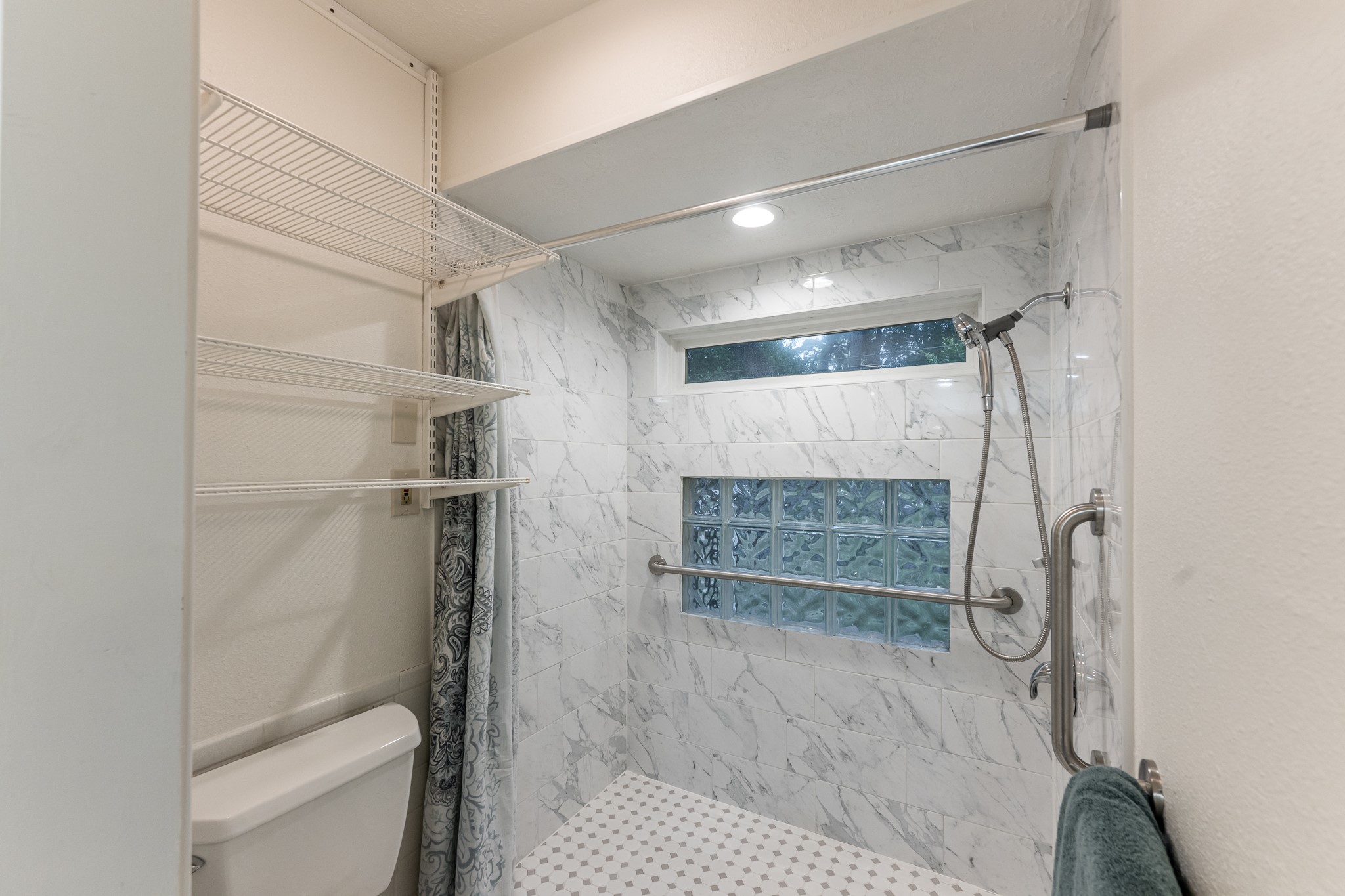 206 Hickory Ridge Drive Shenandoah, TX 77381 - Photo 23 of 35 a bathroom with a shower and a toilet