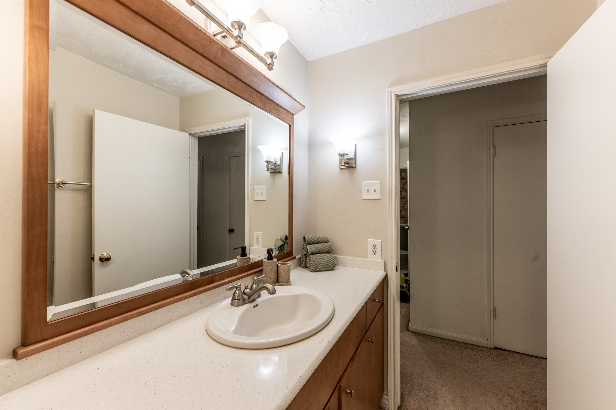 206 Hickory Ridge Drive Shenandoah, TX 77381 - Photo 26 of 35 a bathroom with a sink and a mirror