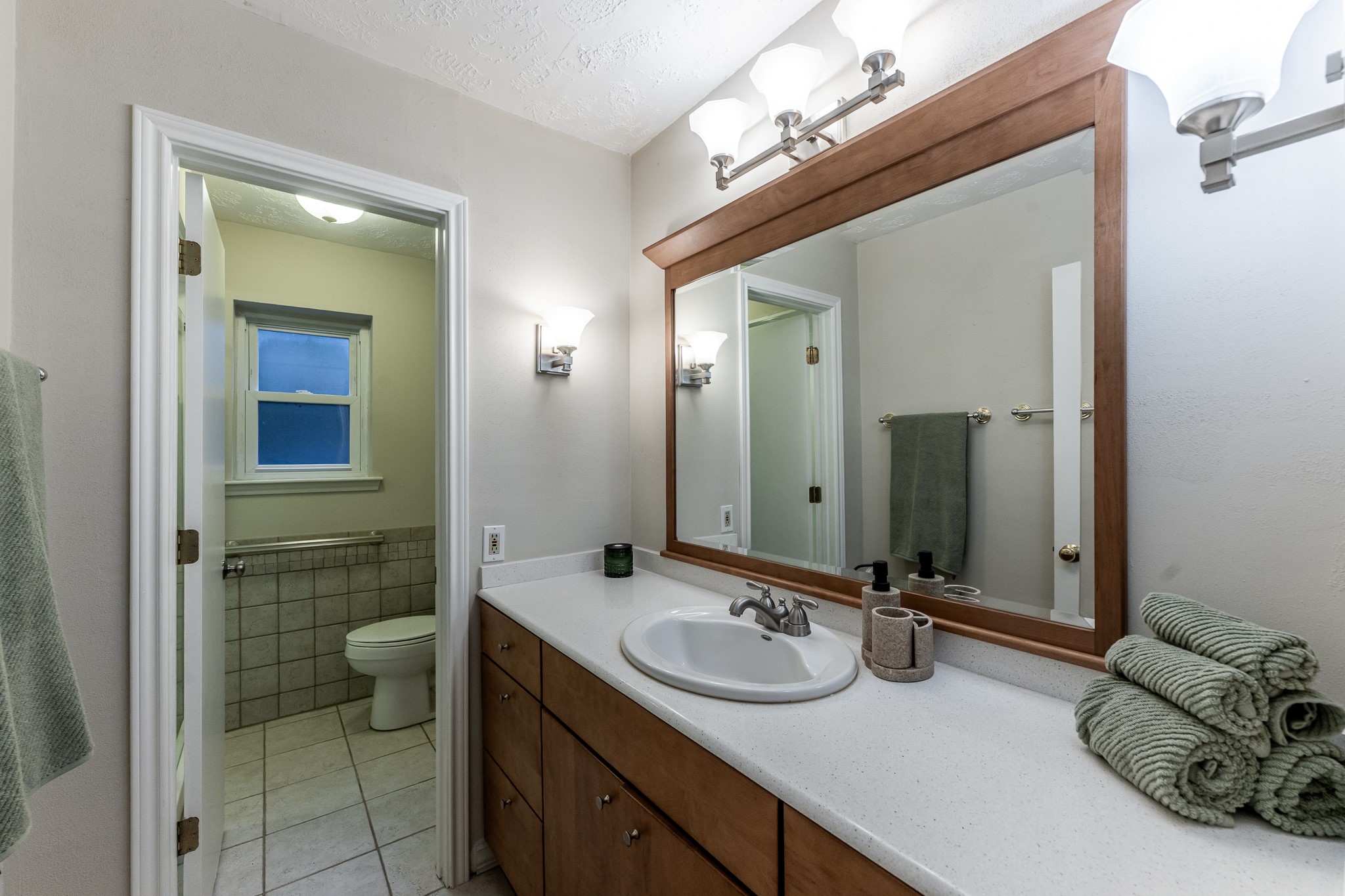 206 Hickory Ridge Drive Shenandoah, TX 77381 - Photo 27 of 35 a bathroom with a double vanity sink mirror and toilet