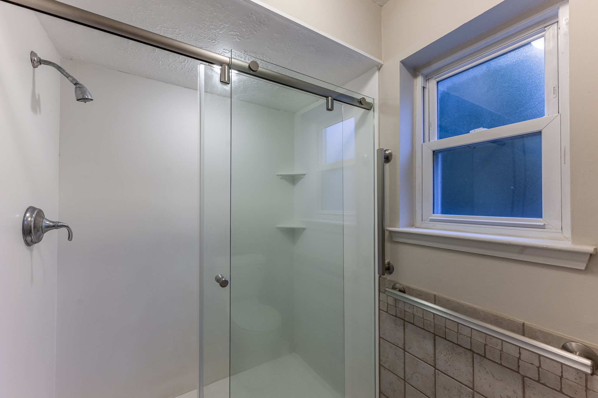 206 Hickory Ridge Drive Shenandoah, TX 77381 - Photo 28 of 35 a bathroom with a shower