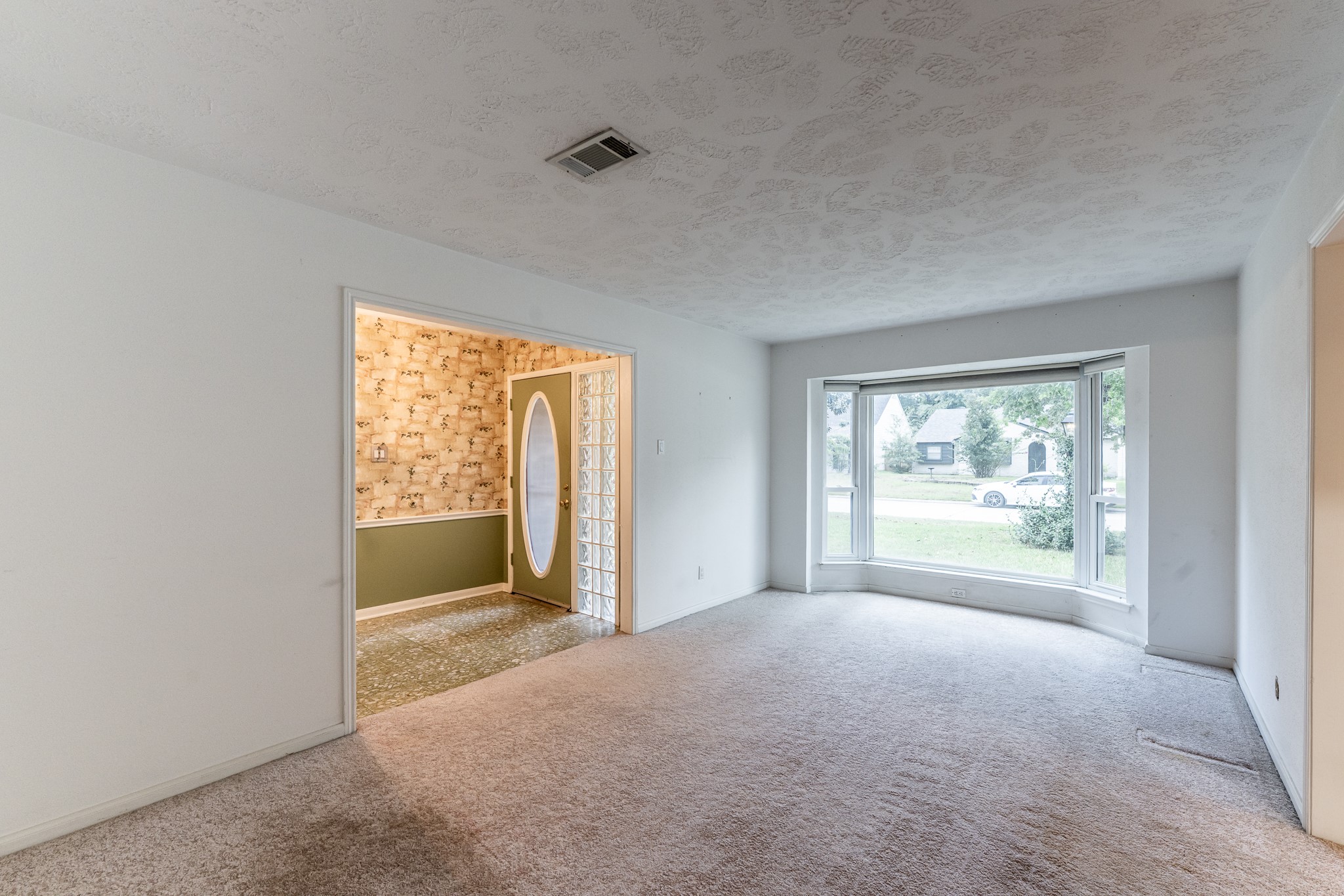 206 Hickory Ridge Drive Shenandoah, TX 77381 - Photo 6 of 35 a view of an empty room with a window