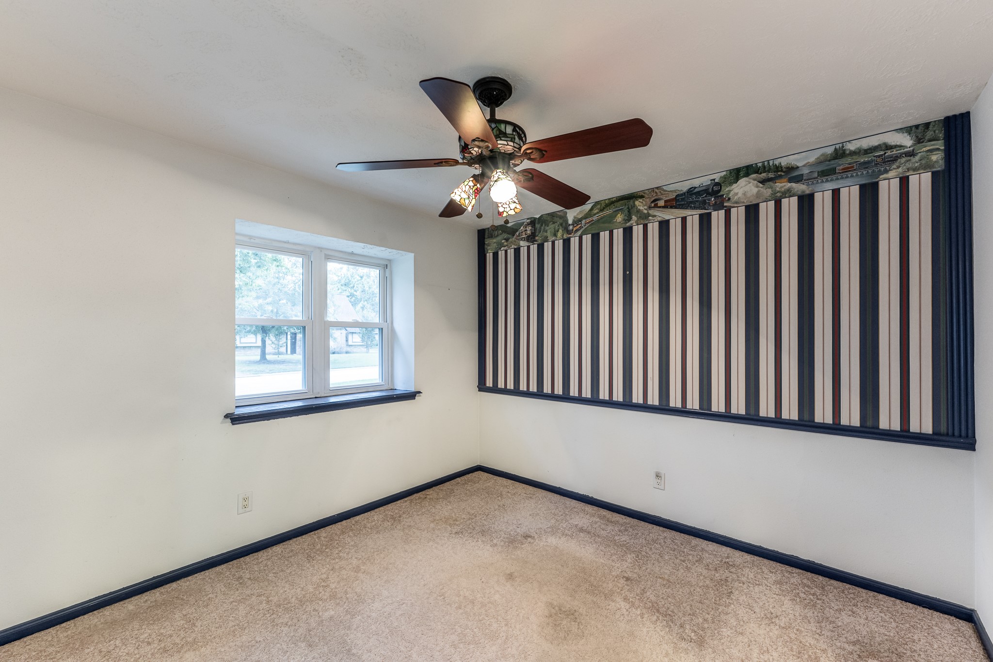 206 Hickory Ridge Drive Shenandoah, TX 77381 - Photo 8 of 35 a view of an empty room with a window