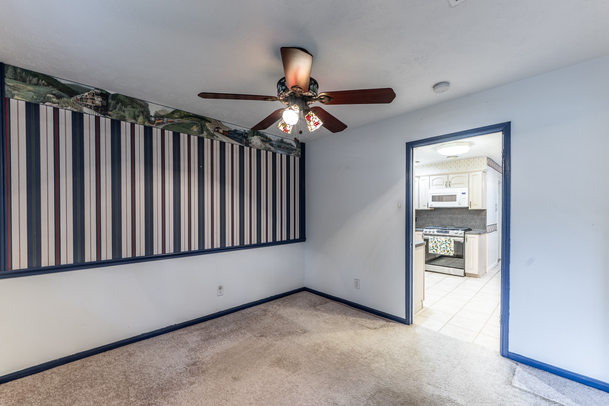 206 Hickory Ridge Drive Shenandoah, TX 77381 - Photo 9 of 35 a room with ceiling fan and wooden floor