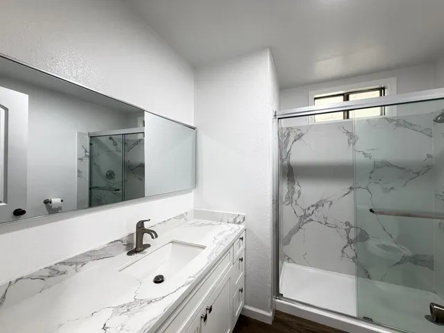 a bathroom with a sink and a mirror