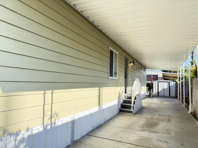 a view of a porch with furniture