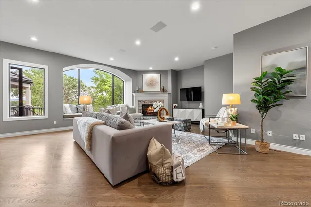 a living room with furniture a table and a flat screen tv