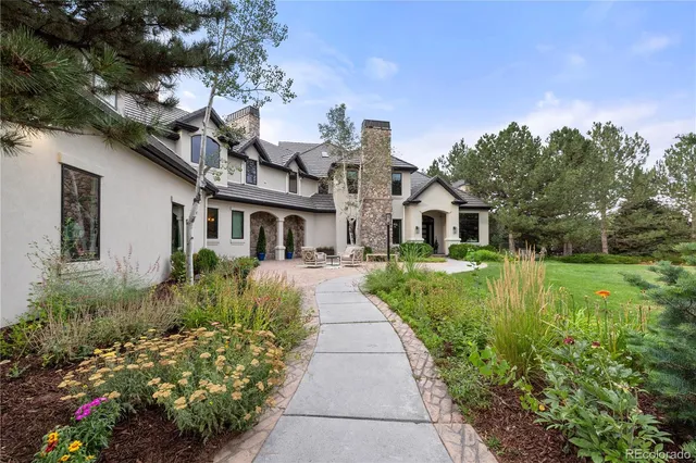 a view of a patio with table and chairs and wooden floor