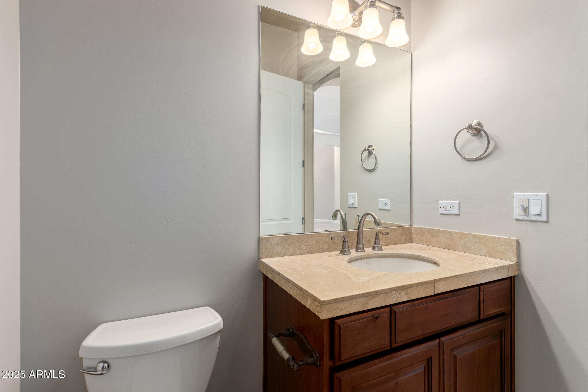 16738 East Lone Mountain Road Scottsdale, AZ 85262 - Photo 36 of 88 a bathroom with a sink a toilet and a mirror