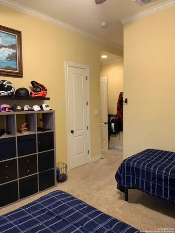 a bedroom with a bed and a closet