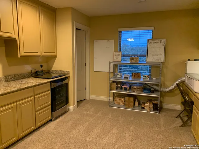 a kitchen with stainless steel appliances granite countertop a stove and a cabinets