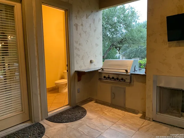 a view of a chairs and table in patio
