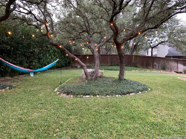 a living room with fireplace furniture and a flat screen tv