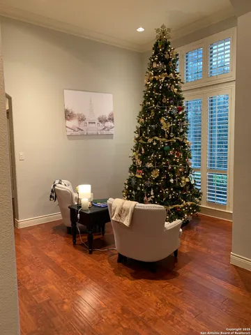 a living room with furniture stairs and a window