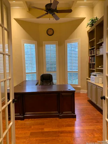 a view of workspace with wooden floor