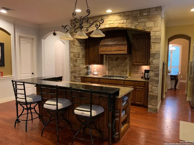 a kitchen with a table and chairs in it