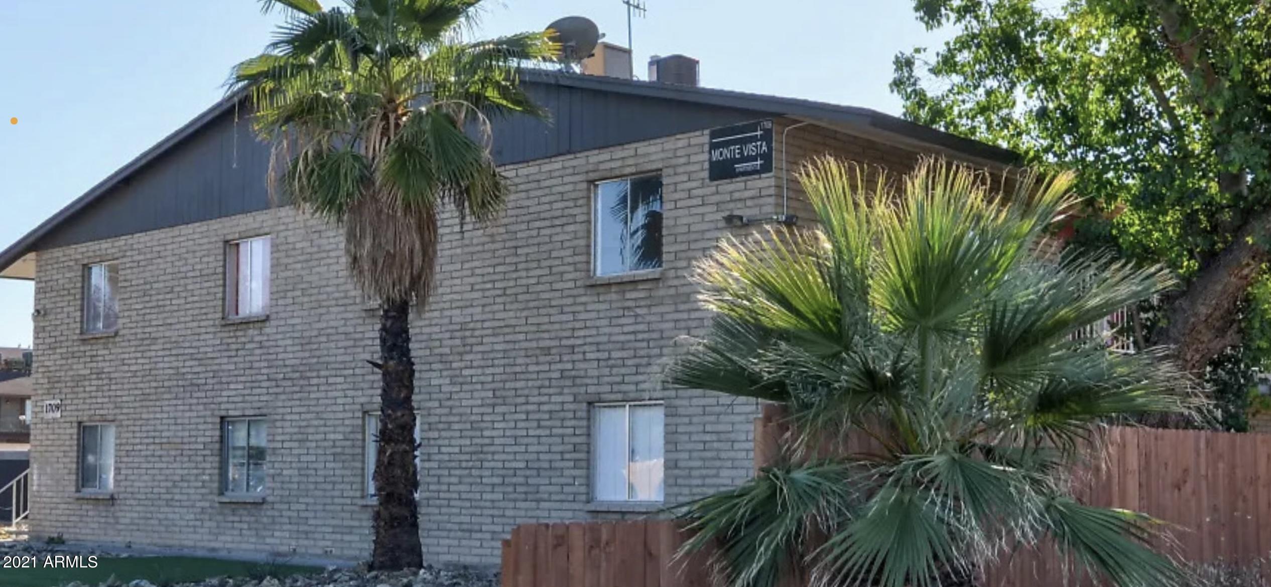 1709 West Mountain View Road, Unit 105 Phoenix, AZ 85021 - Photo 1 of 7 a plant that is in front of a house