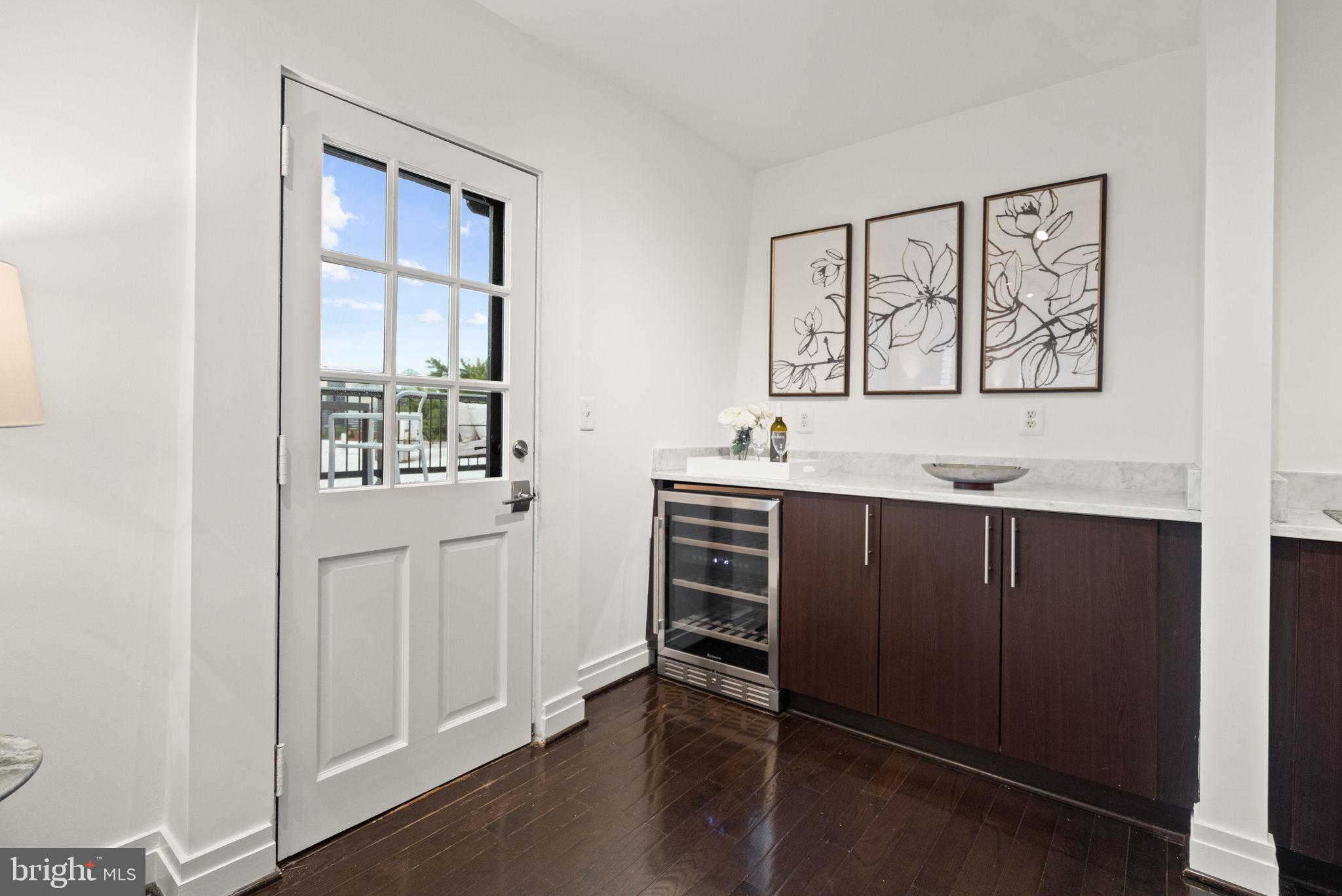 3246 N Street Northwest, Unit 4A Washington, DC 20007 - Photo 13 of 31 Wine fridge & deck access