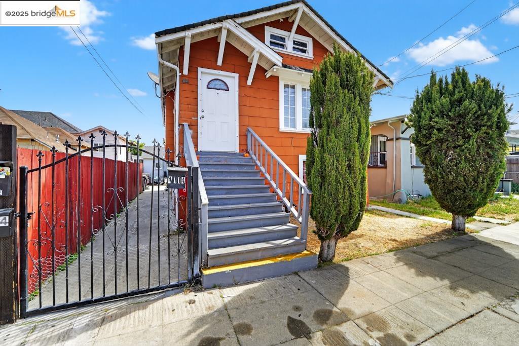 4114 East 17th Street Oakland, CA 94601 - Photo 1 of 39 a view of a house with wooden fence