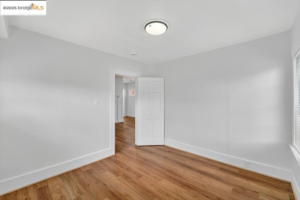 4114 East 17th Street Oakland, CA 94601 - Photo 12 of 39 a view of an empty room with wooden floor